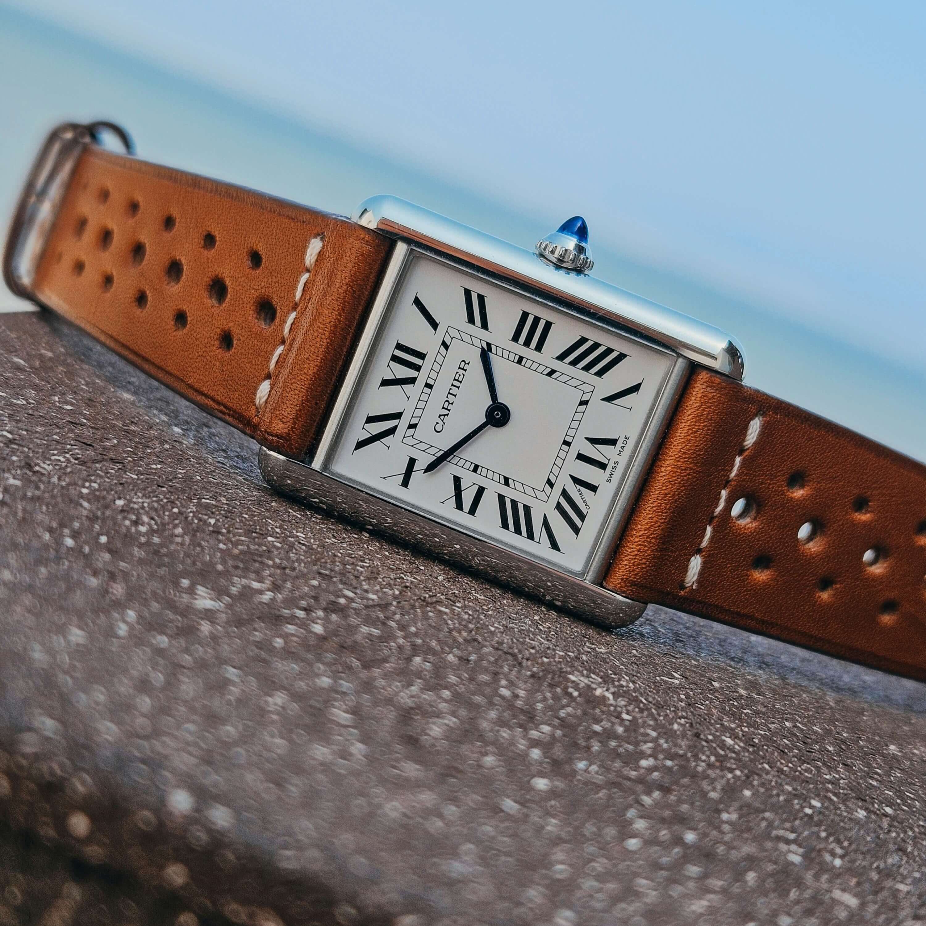 Elegant watch with Paris Racing Lederband in brown Barenia leather, featuring a stainless steel case and Roman numeral dial.