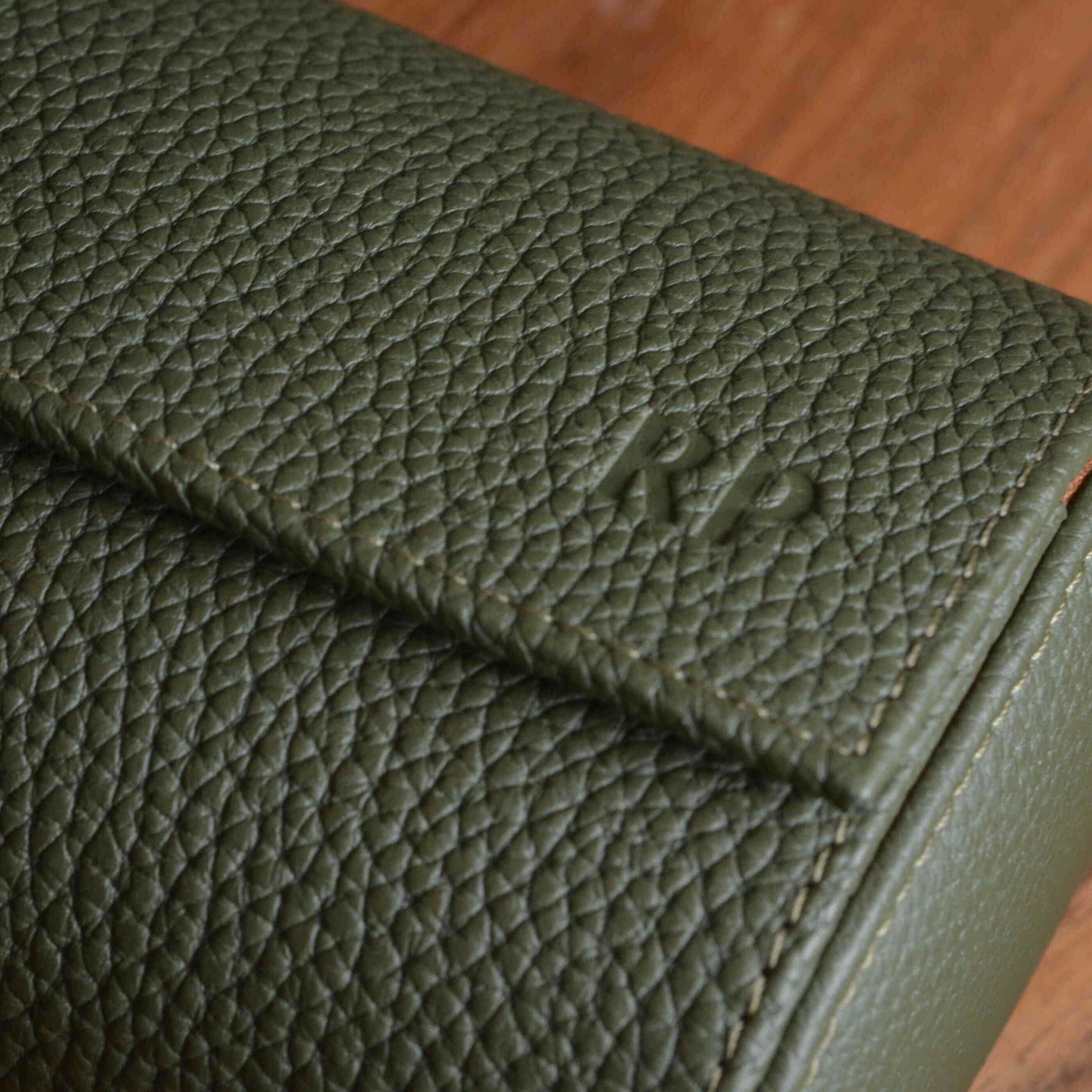 Close-up of handcrafted Togo leather watch roll by FLUCO.