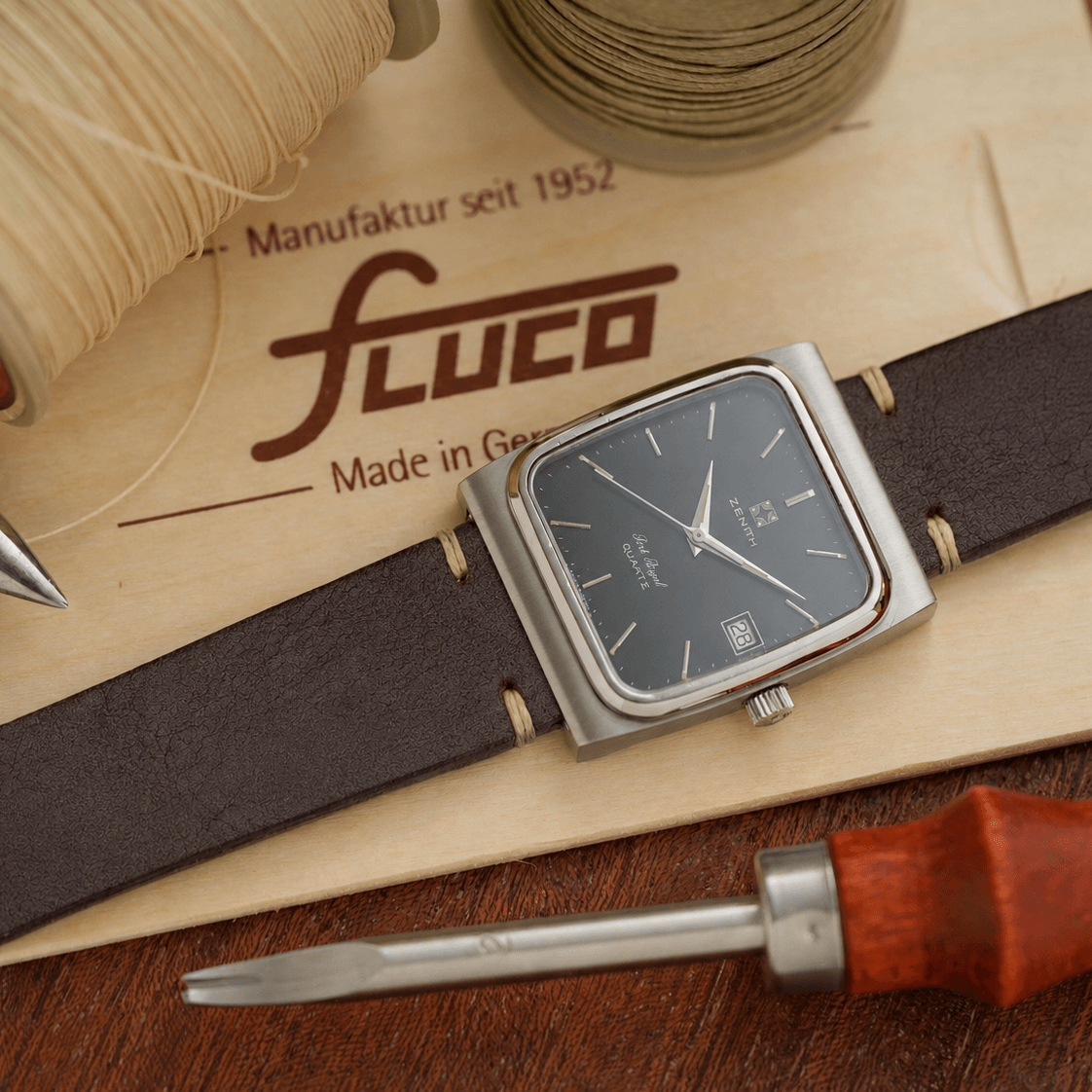 Dark brown handcrafted vegetable-tanned leather watch strap made in Tuscany, Italy, with fine hand stitching, natural leather grain, polished edges, and stainless steel buckle.
