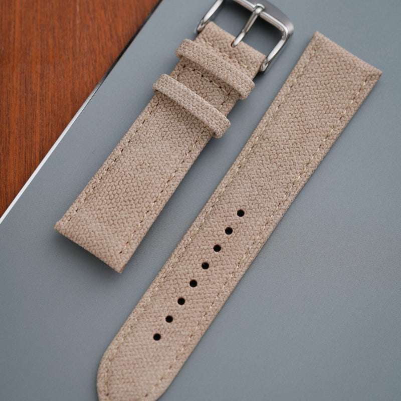 Beiges Canvas-Uhrenarmband auf grauem Hintergrund, passend für Rolex Oyster Perpetual