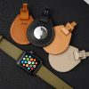 4 Apple Air Tag leather etuis with an apple watch on an olive leather watchstrap